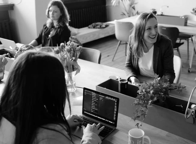 an image of people in an office working